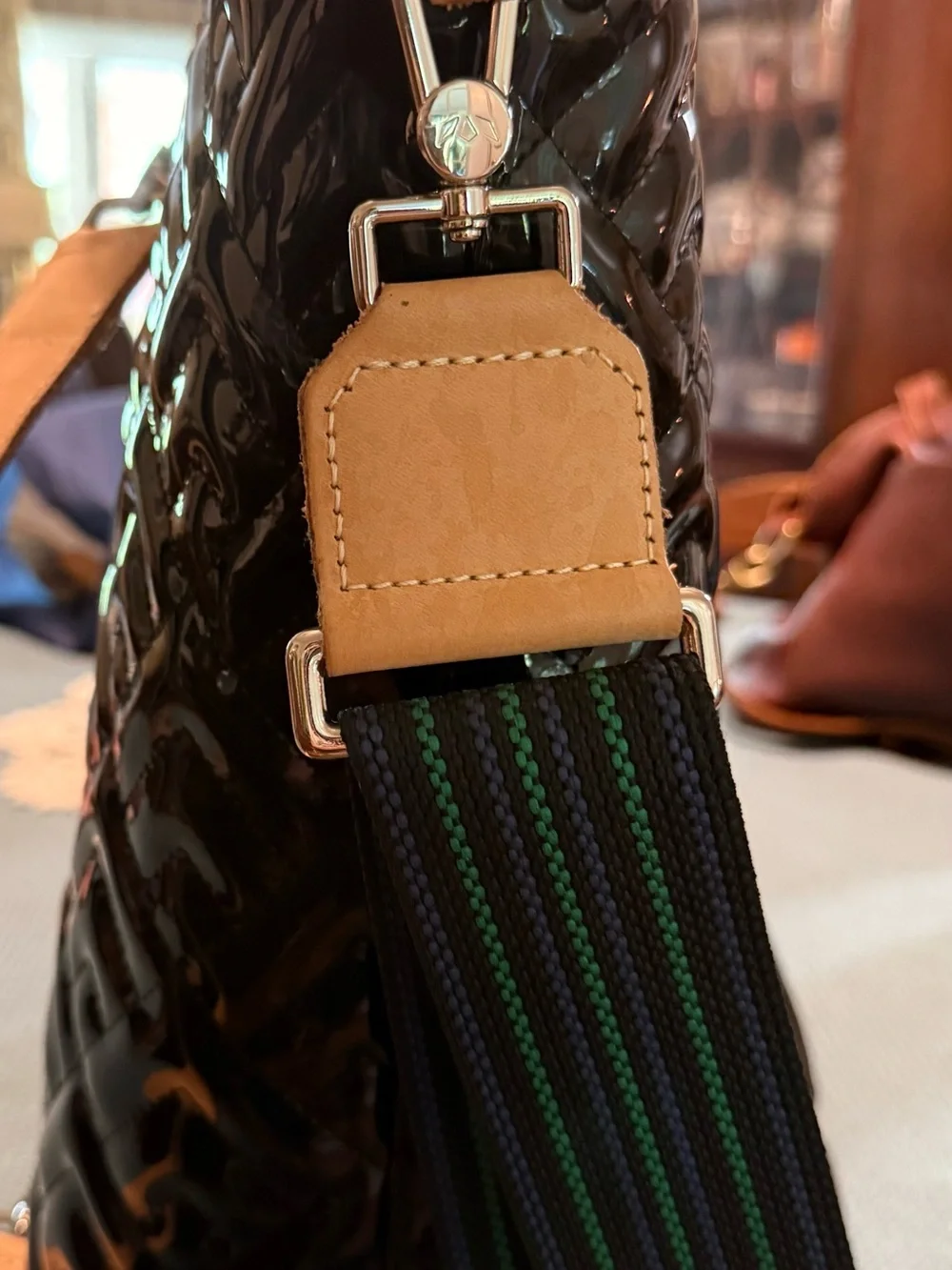 Consuela Inked Sling Black Quilted Patent Sling Tote with Tan Leather Trim